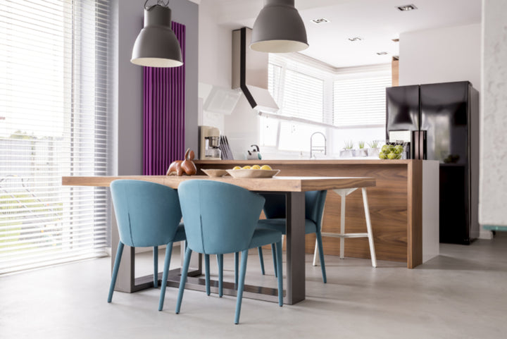 White blinds in kitchen with dining table