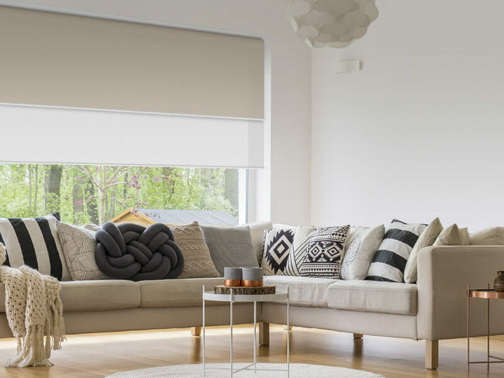 Dual blockout and light filter roller blinds in living room