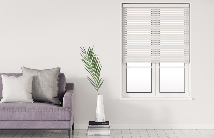 Venetian Wood blinds in bright living room with purple couch