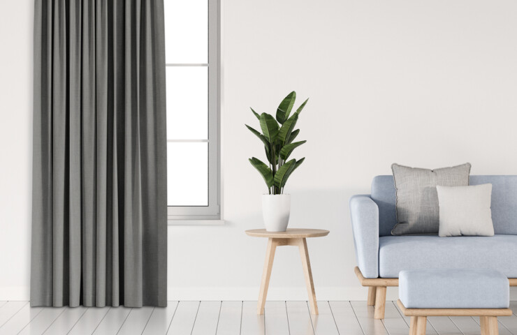 Dark grey blockout curtain on white walls in living room
