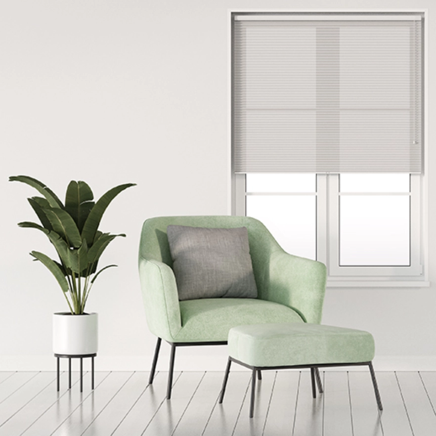 Honeycomb Sheer blinds in bright living space with green chair