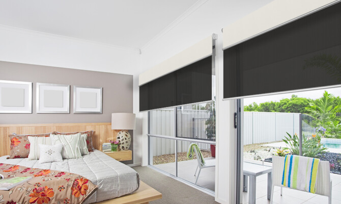 Dark Roller Dual blinds in bedroom with sliding doors