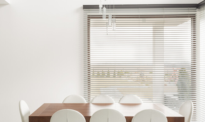 Venetian Faux wood blinds in front of dinning room