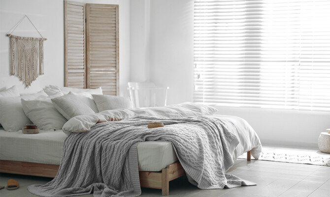 Venetian Faux wood blinds in sunny bedroom