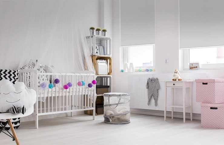 White Roller Blockout blinds in nursery room