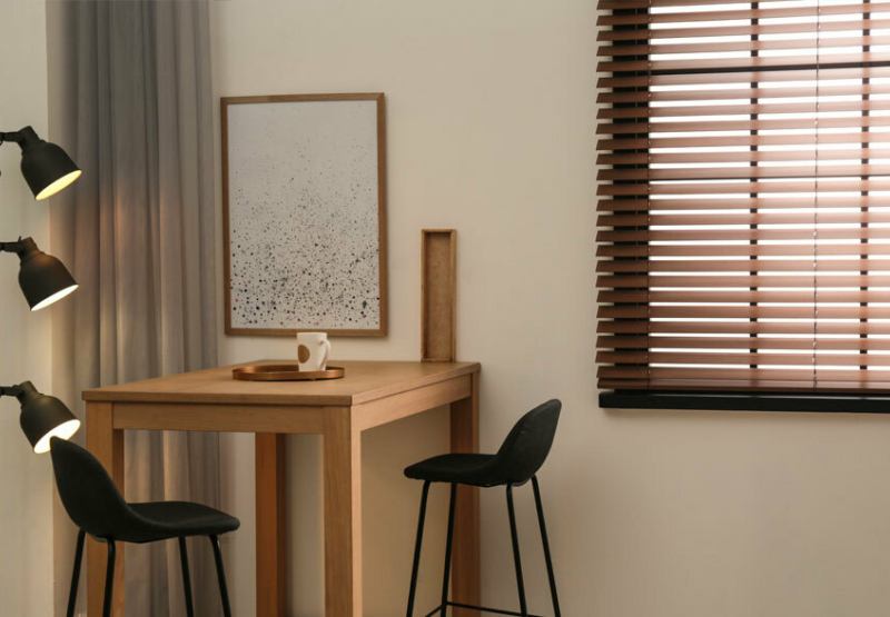 P64614 Venetian Wood blinds in room with square table and chairs