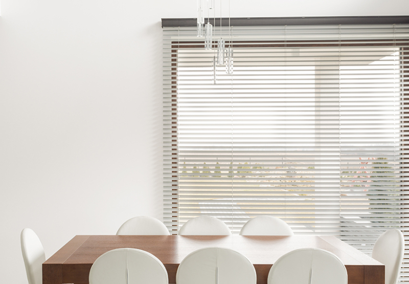 Venetian Faux wood blinds in front of dinning room