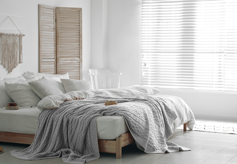 Venetian Faux wood blinds in sunny bedroom