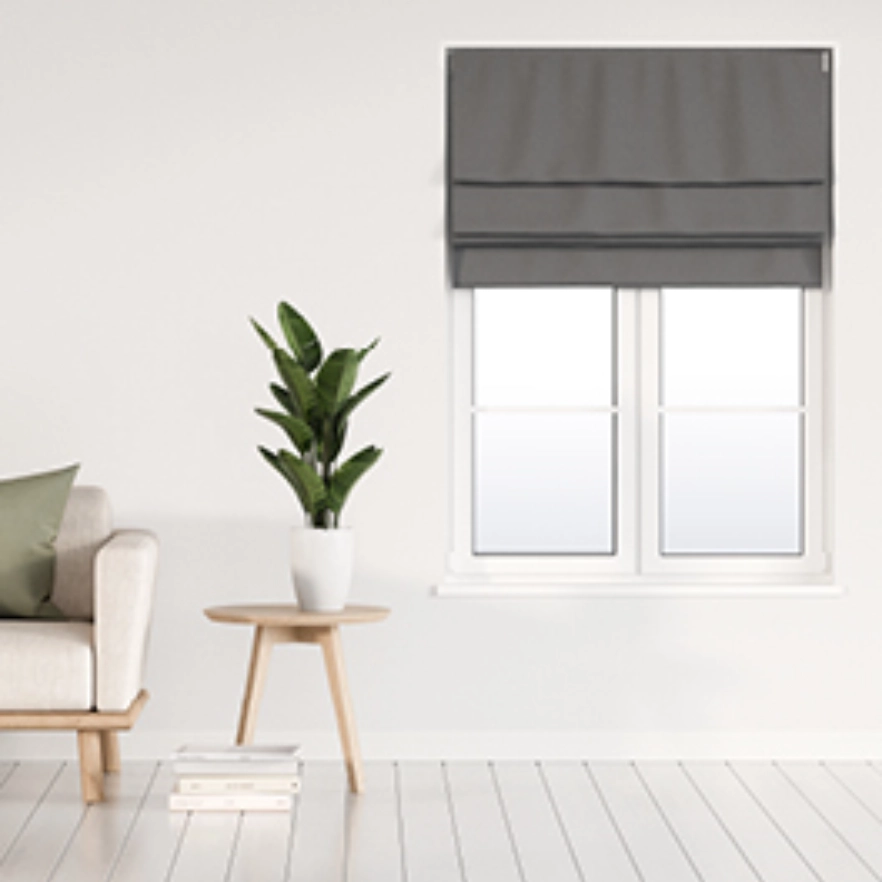 Dark roman blinds in bright living space